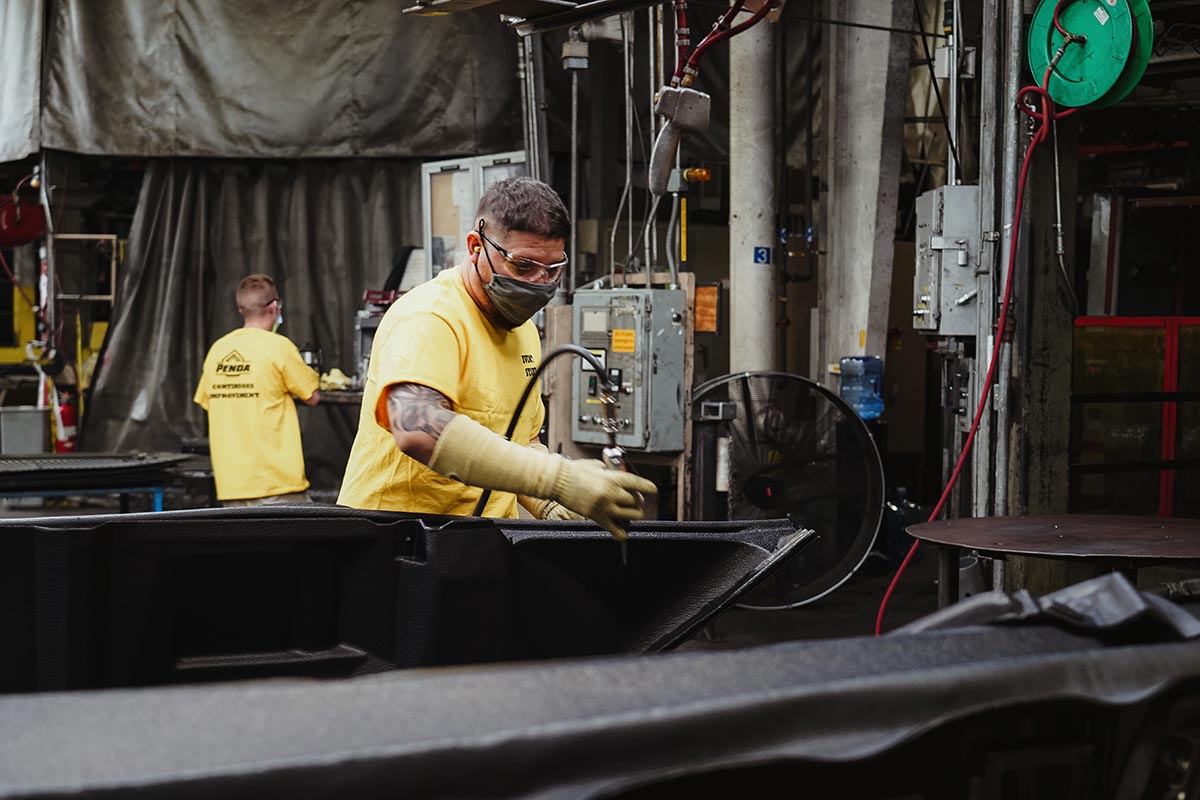 Penda employees finishing plastic products